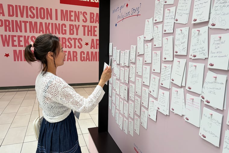 The Philly Love Stories exhibition is located inside the Fashion District, by the 9th and Market street entrance. Sophear Chansath, who moved to Philadelphia from Cambodia, is seen writing about her love for the city.