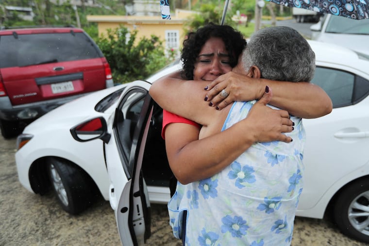 Quetcy Lozada embraces her aunt Elisa DelValle after two weeks as a volunteer with the Salvation Army in Puerto Rico Tuesday October 31, 2017.