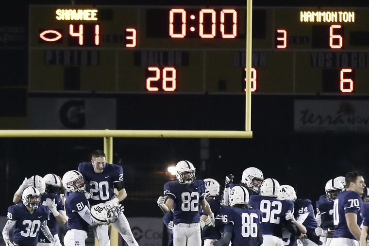 Shawnee football players celebrate after beating Hammonton last year to capture the South Jersey Group 4 title.