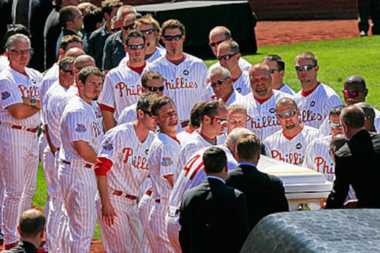 Phillies players line up to pay their respects during a ceremony at Citizens Bank Park on Saturday. (Akira Suwa / Staff Photographer )