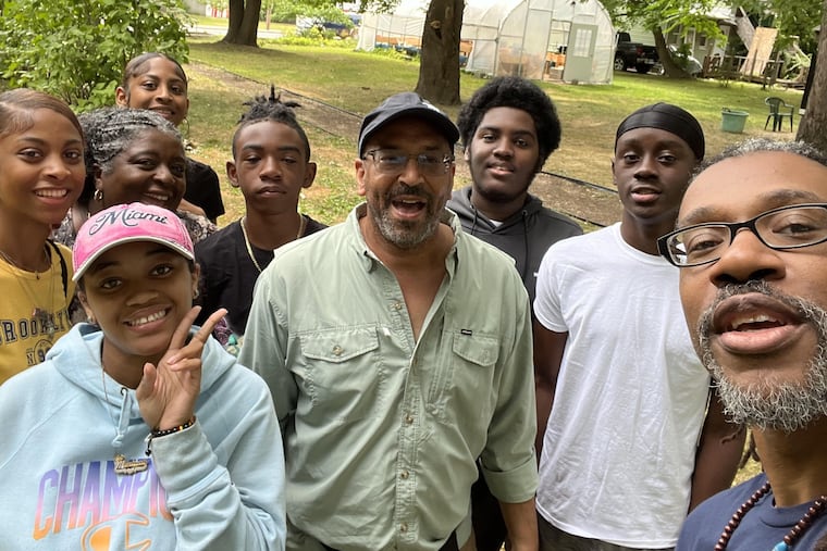 Philadelphia "walking artist" Ken Johnston (center) met with teenagers who are part of a summer program, the Young Abolitionist Leadership Institute or YALI, at the Underground Railroad Education Center in Albany on Wednesday.