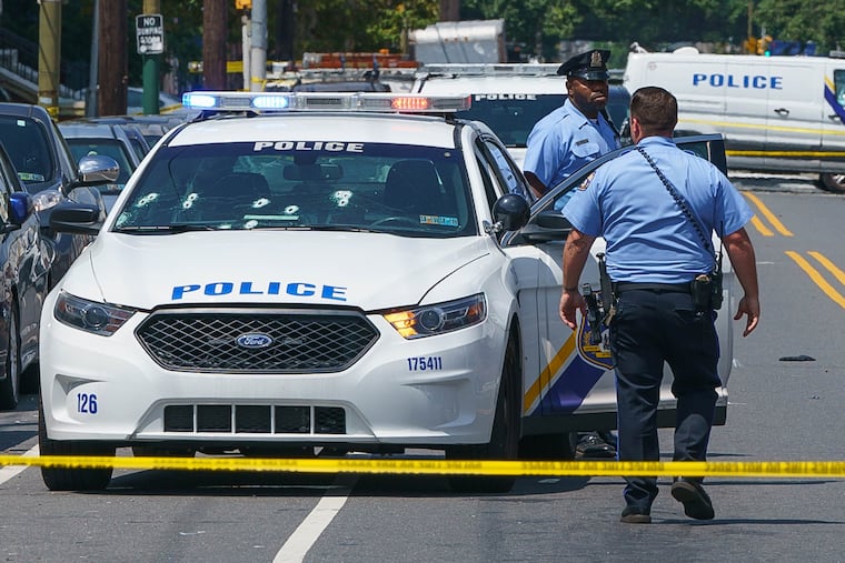 Bullet holes in a police car windshield at 20th and Snyder in South Philadelphia.,