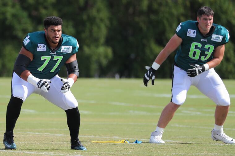 Andre Dillard (left) and rookie offensive tackle Jack Driscoll, warming up for Friday's practice.