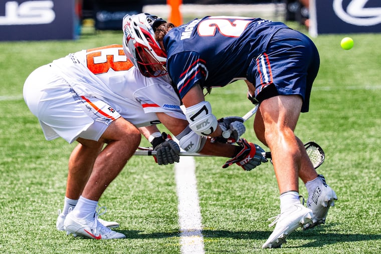 Andrew McMeekin (right), who plays for the Boston Cannons, ranks third in the Premier Lacrosse League in faceoff percentage.
