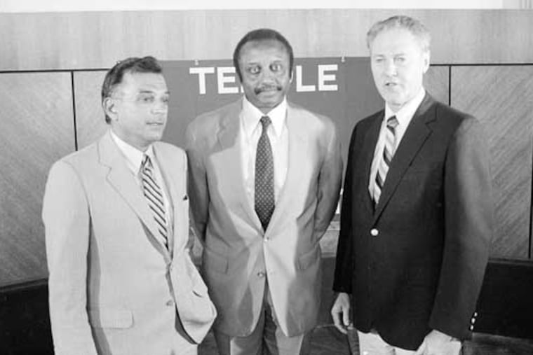 John Chaney poses for a photo with Temple president Peter J. Liacouras (left) and athletic director Gavin White Jr. (right) following Chaney's introductory press conference as the Owls' men's basketball coach back on Aug. 18, 1982.