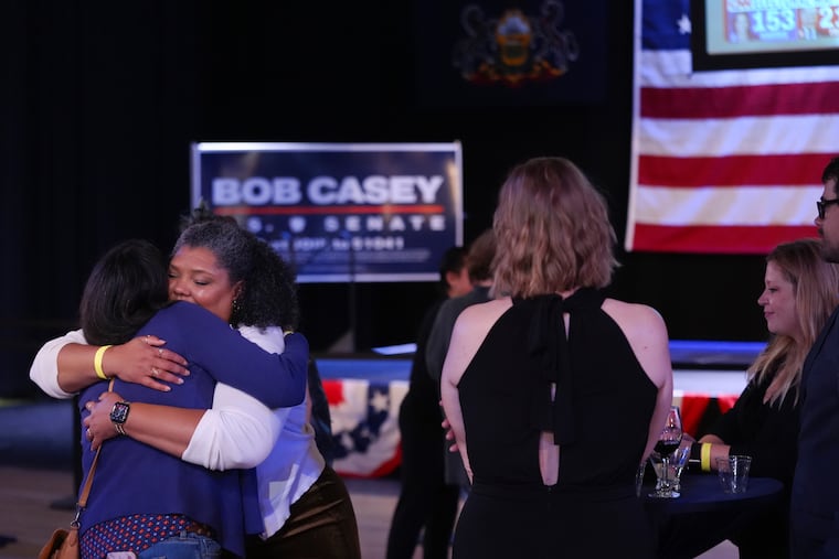 Supporters hug goodbye as they prepare to leave an election night watch party for Sen. Bob Casey, D-Pa. The Associated Press called the race for Republican Dave McCormick Thursday, but a recount remains possible.