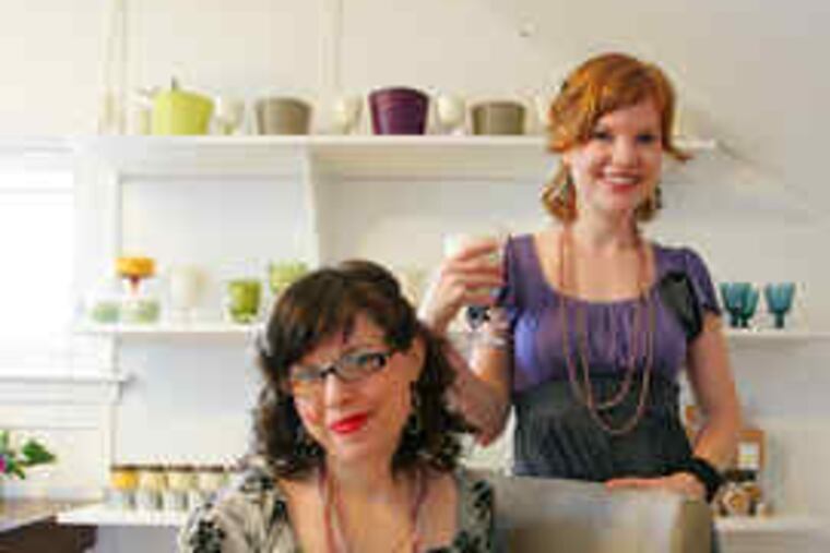 Olivia Lotz (left) and Liz MacDonald got their big break last summer when a Whole Foods store agreed to sell their eco-friendly candles.