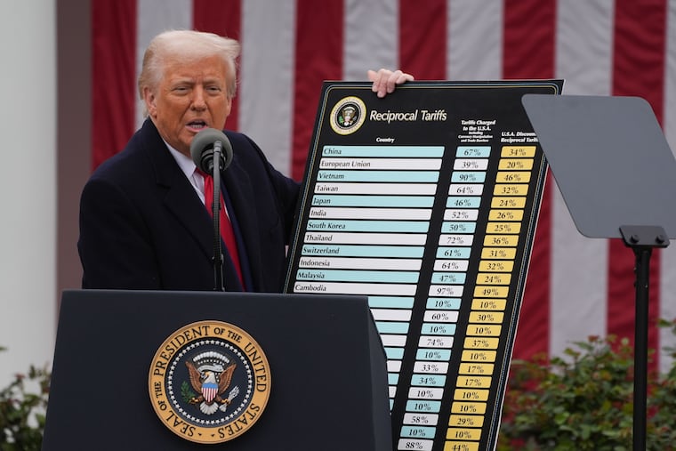President Donald Trump holds a chart as he announces a plan for tariffs on April 2, 2025. He is now on his third round of tariffs, and they have had less impact on markets and policy.