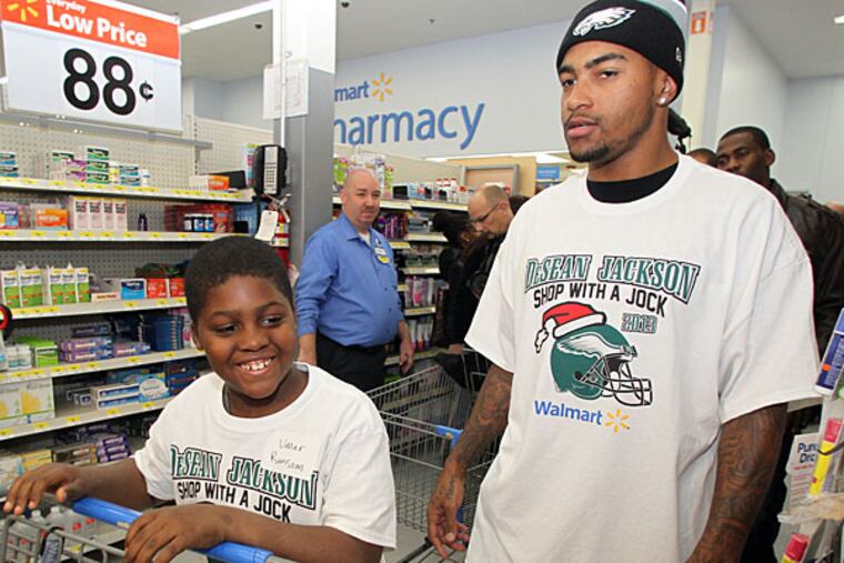 Eagles receiver DeSean Jackson and Umar Ransom prepare to shop during a shopping spree for underprivileged kids at the Walmart on South Christopher Columbus Blvd on Tuesday, December 3, 2013. (Yong Kim/Staff Photographer)