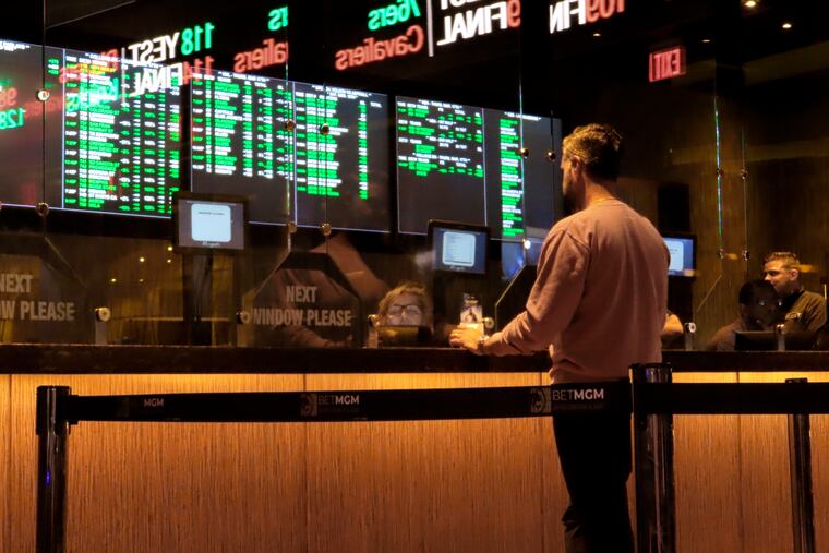 A customer makes a sports bet at the Borgata casino in Atlantic City N.J. on March 17, 2022 just before the March Madness college basketball tournament began. On March 24, 2022, a New Jersey state Senate committee advanced a bill that would give Atlantic City money from a 1.25% tax on sports betting revenue made by casinos and tracks, to be used for local tax relief. (AP Photo/Wayne Parry)