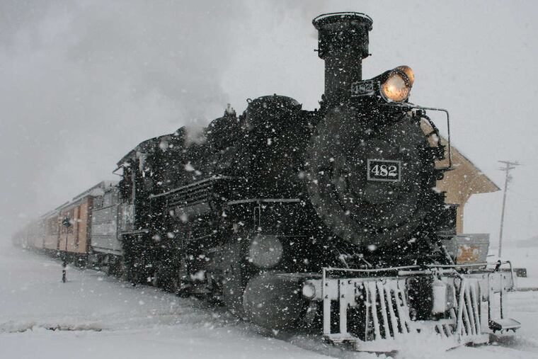 A Durango & Silverton Narrow Gauge Railroad passenger train arrives in Silverton, Colo., amid a storm that dropped more than a foot on the San Juan Mountains.