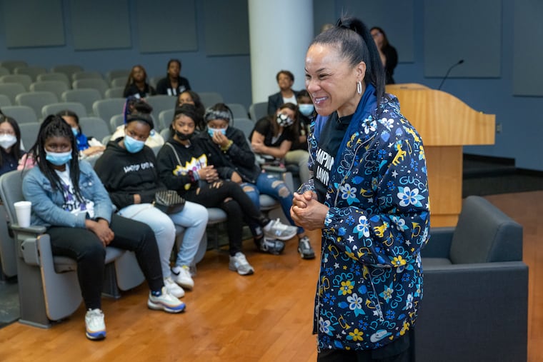 Basketball coach Dawn Staley speaks with young girls from Paul L. Dunbar a K-8 school located on N. 12th Street near Temple University. Staley was at Temple to speak at the 2022 Philadelphia Coaches Conference held at Temple University School of Sports, Tourism and Hospitality Management, Alter Hall, Temple campus on Tuesday morning May 10, 2022.