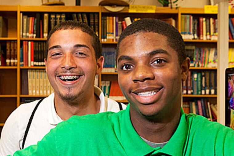 "I would have dropped out" without Jamil Miller (right), said Kevin Ruiz (left). Miller returns the compliment: "To be honest, I think I would have gone down the wrong path." The two have been friends since fourth grade. (Ed Hille/Staff)