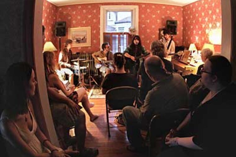 Samantha Crain and her band perform in the Bob Beach home in Lansdowne. Artists generally get 100 percent of the cover charge, and a thoroughly attentive audience, for such concerts. (DAVID M WARREN / Staff Photographer)