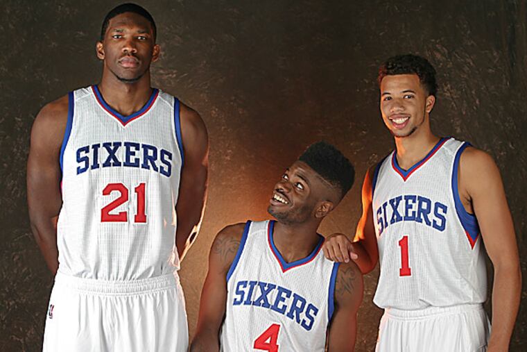 The 76ers' Joel Embiid, Nerlens Noel and Michael Carter-Williams. (Steven M. Falk/Staff Photographer)