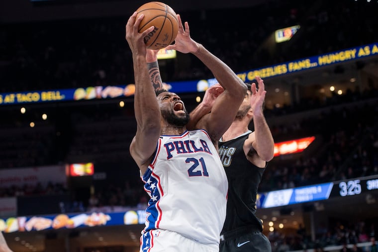 Sixers center Joel Embiid (21) shoots against Memphis Grizzlies guard John Konchar in the second half. Embiid flirted with a triple-double in the Sixers' loss