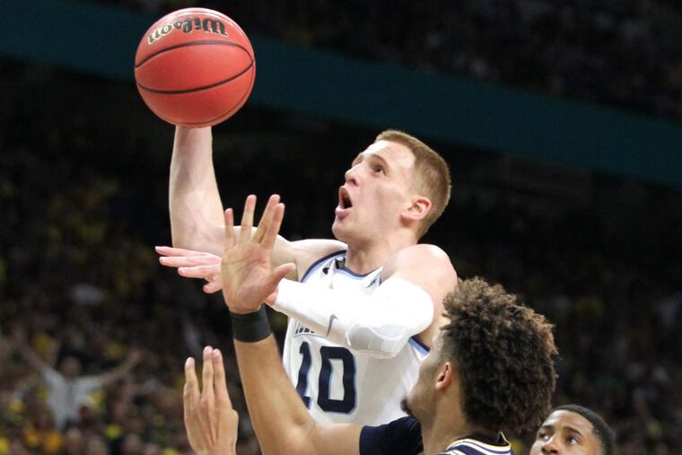 Villanova’s Donte DiVincenzo goes up for a shot against Michigan’s Isaiah Livers during the first half.