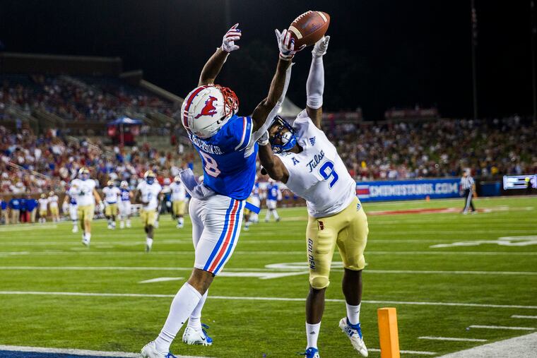 Tulsa cornerback Reggie Robinson, shown defending a pass against SMU last season, could be a third- or fourth-round possibility for the Eagles in the draft.
