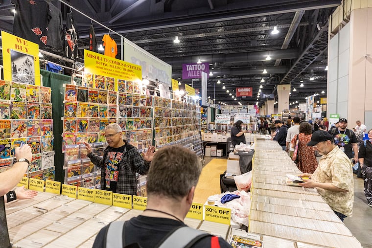 Ruben Miranda, 56, of New York City, and a salesman at Absolute Comics & Statues, talks with guests at the 2024 Comic Book Fan Expo at the Pennsylvania Convention Center on Friday, May 3, 2024.