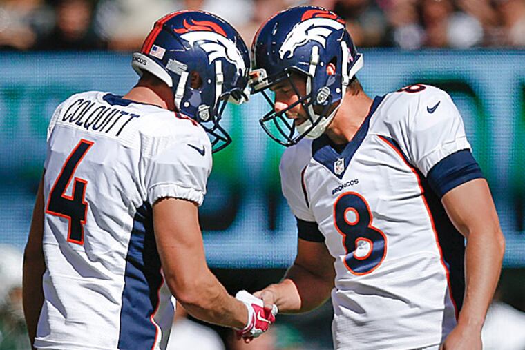 Broncos kicker Brandon McManus is congratulated by punter Britton Colquitt. (Kathy Willens/AP)