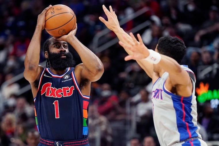 Philadelphia 76ers guard James Harden (1) shoots over the defense of Detroit Pistons guard Frank Jackson during the first half of an NBA basketball game, Thursday, March 31, 2022, in Detroit. (AP Photo/Carlos Osorio)