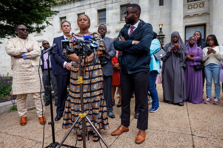 Fanta Bility's mother, Tenneh Kromah, speaks to reporters outside the Delaware County Courthouse after the sentencing of the officers who shot her daughter.