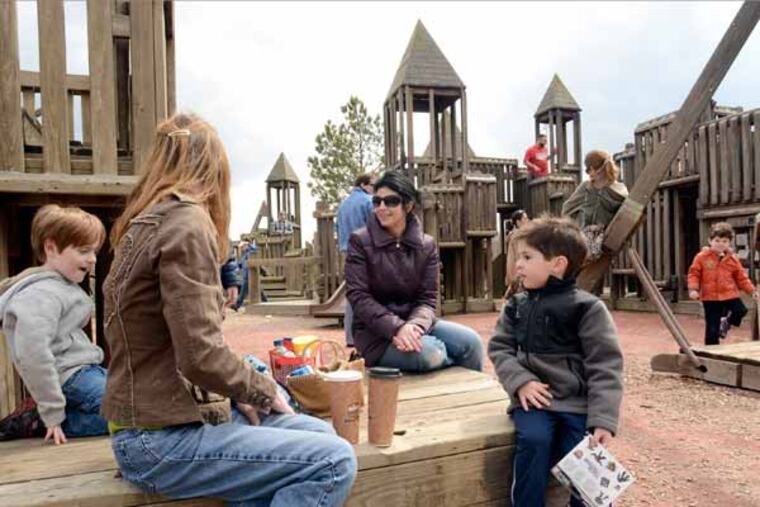 Lisa Giordano (cq-left) and Rae Perkowitz (cq-right) have a snack with their sons Frankie Perkowitz (cq-left, 5 yrs) and Frankie Giordano (cq-same frist names, right, 4 yrs) in the Memorial Field playground in Marlton April 1, 2013. The town will be tearing down the 1993 wooden playground and replacing it with a metal-and-vinyl version. ( TOM GRALISH / Staff Photographer )