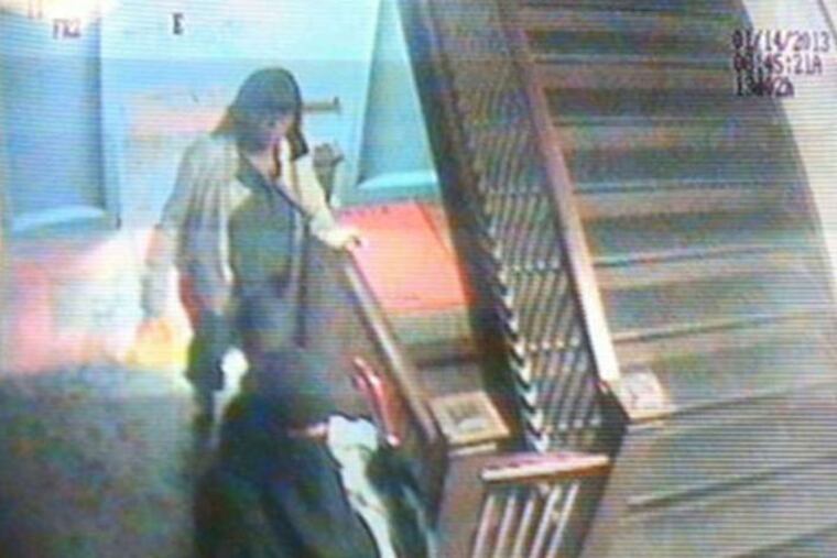 A surveillance video still from Bryant Elementary shows a woman, identified as Christina Regusters, dressed in Muslim garb while kidnapping a 5-year-old girl from school. Regusters was found guilty Sept. 12, 2014.