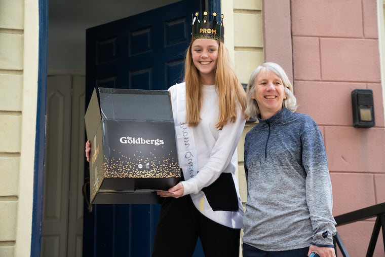 Anne Flemming, left, holds a Prom Gift Box that she received, with her mother Elizabeth Flemming, in Philadelphia, May 12, 2020.