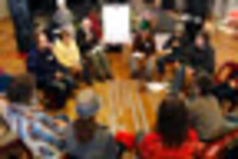 Occupy activists attend a nonviolent civil disobedience training at the Occupy the Caucus headquarters, Tuesday, Dec. 27, 2011, in Des Moines, Iowa. Starting Wednesday, Occupy protesters are vowing to interrupt candidates at events and make life difficult at their Iowa offices by camping inside or outside them. They say they want to change the political dialogue, but critics fear their tactics could tarnish Iowa's reputation for civil political discourse ahead of the Jan. 3 caucuses. (AP Photo/Charlie Neibergall)