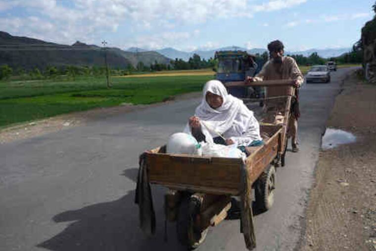 Residents flee fighting between Taliban militants and Pakistan troops near Mingora, Pakistan.