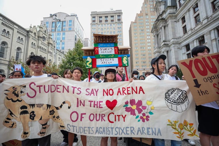 Benise Bacani, 18, of South Philly, (center) with Students Against Sixers Arena organization demonstrates at City Hall in Philadelphia on Saturday, Sept. 7, 2024.