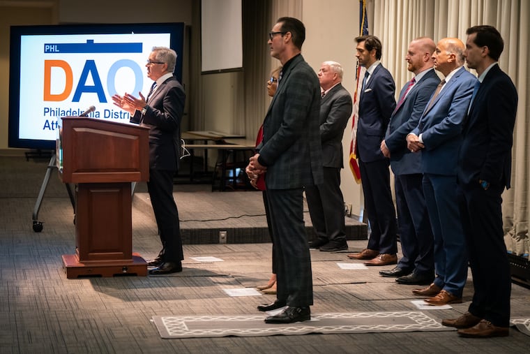 Philadelphia District Attorney Larry Krasner, left, speaks during a news conference on Thursday to announce the arrest of a woman charged with running a fentanyl packing and narcotics operation.