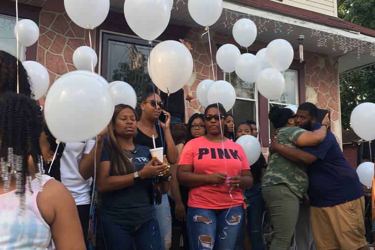 Friends and family held a vigil for Curtis Jenkins III Wednesday night in Camden outside the home of Lisa Robinson, his great-aunt. Those who gathered said a prayer and released more than 50 white balloons.
