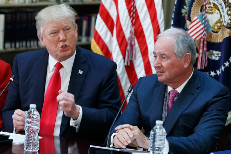 Stephen Schwarzman (right) with President Donald Trump (left) at a meeting in April of 2017.