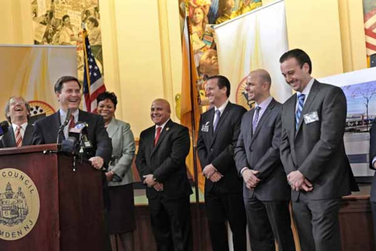 A press conference to announce that a new Shop Rite is coming to Camden, photos taken on March 19, 2013. Here, from left to right: Ken Goldenberg, founder and CEO of the Goldenberg Group; State Sen. Donald Norcross; Camden Mayor Dana Redd; Camden City Council President Frank Moran; Shawn Ravitz; Jeremy Fogel, Exec. VP and Dir. of Development for the Goldenberg Group; Brett Ravitz; and Jason Ravitz. The Ravitz brothers, part of a family that operates 5 Shop Rite stores in Camden and Burlington Counties, will be the owners/operators of the new store. ( APRIL SAUL / Staff )