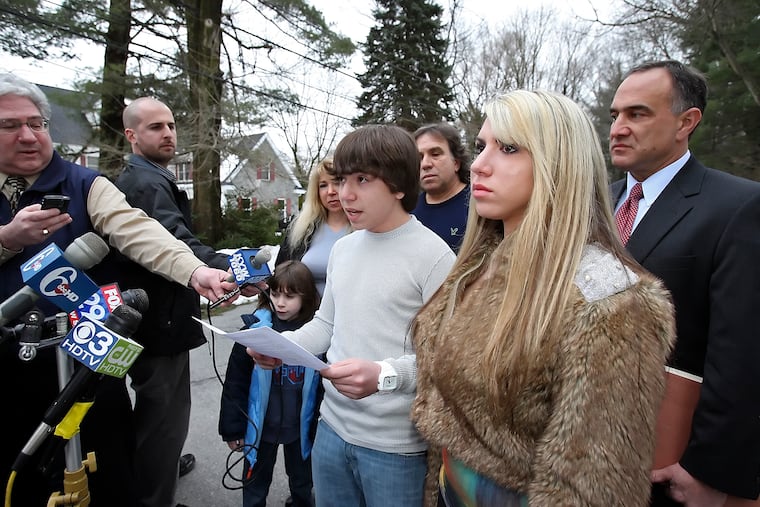 Webcam victim Blake Robbins, at home with his family and attorney Mark Haltzman (at right), reads a family statement on Feb. 24, 2010.