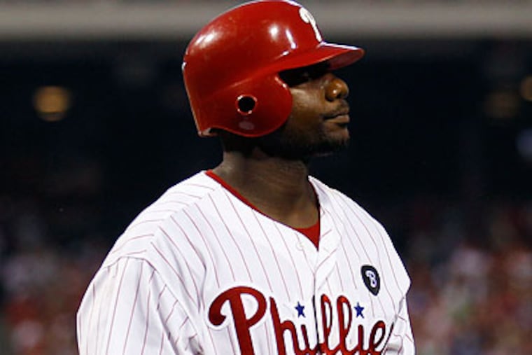 Ryan Howard walks back to the dugout after striking out in the fifth inning. (Yong Kim/Staff Photographer)