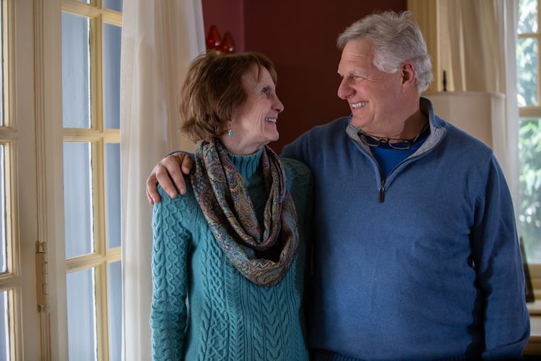 Page Talbott stands in her home with her husband, Jim Gould, in Bala Cynwyd on Sunday, February 17, 2019. The couple volunteers with Hosts For Hospitals, which provides overnight accommodation in private homes for out-of-town patients and families receiving care in Philly-area hospitals, which