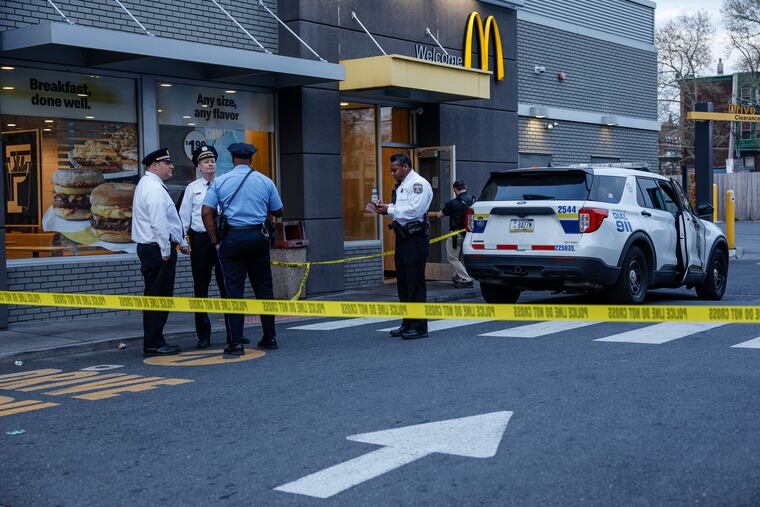 Police at Broad Street and Allegheny Avenue outside McDonald's where a 9-year-old girl was shot in the leg, April 10, 2024.