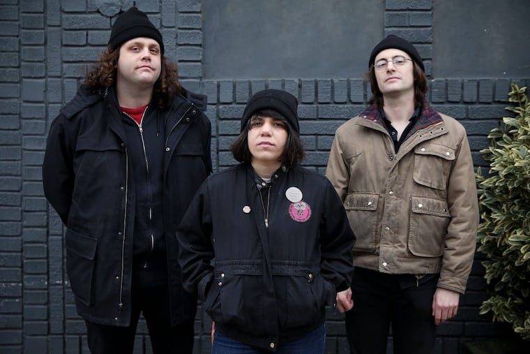 From left, Michael Abbate, Marissa Paternoster and Jarrett Dougherty of the band Screaming Females stand for a portrait outside the Green Line Cafe in West Philadelphia on Wednesday, Jan. 24, 2018. The band releases its seventh album, "All at Once," on Feb. 23. TIM TAI / Staff Photographer