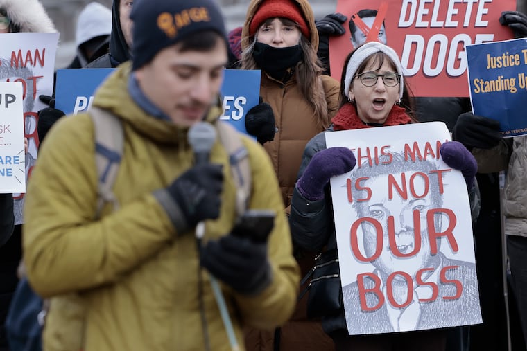 Retired federal worker Roseanne Sarkissian of Philadelphia (right) came to show support during the Save Our Services day of action event, at Independence Mall in on Feb. 19. Federal workers and everyday Americans came together to protest Elon Musk's push to gut federal services and impose mass layoffs.