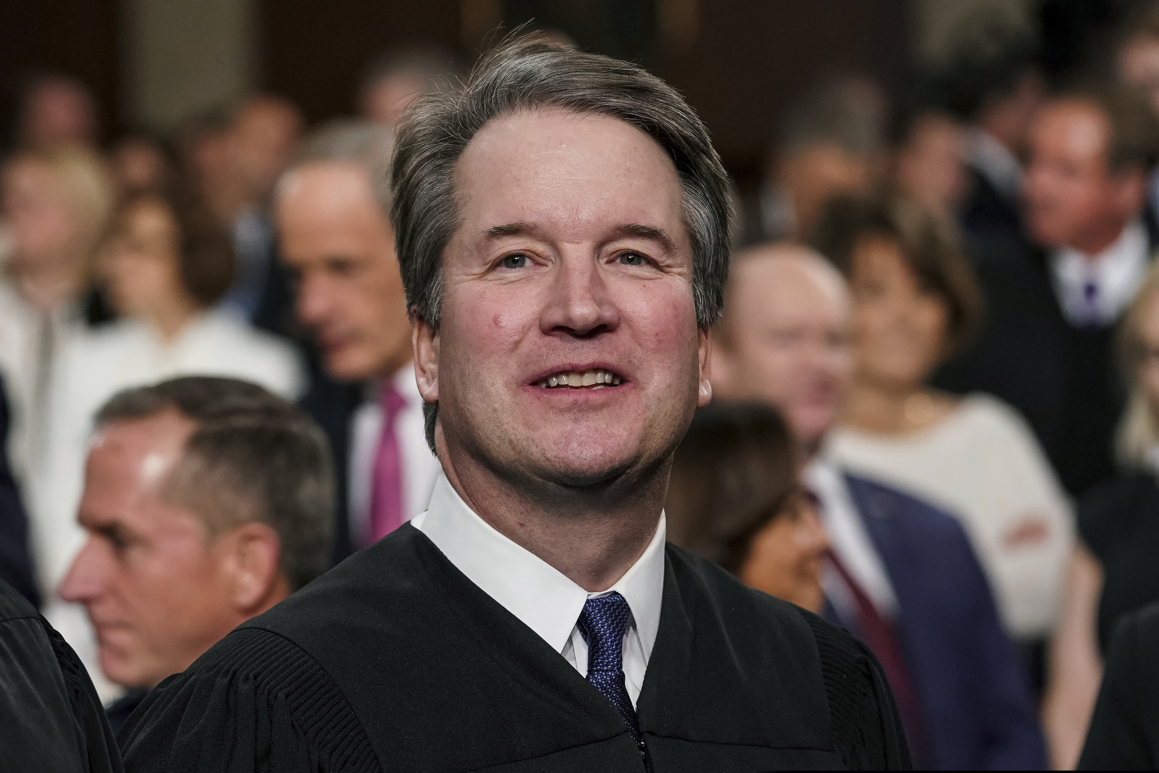 In this Feb. 5, 2019 file photo, Supreme Court Associate Justice Brett Kavanaugh watches as President Donald Trump arrives to give his State of the Union address to a joint session on Congress at the Capitol in Washington.