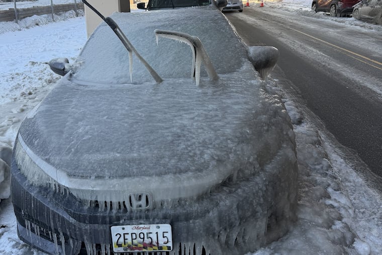 A car parked in Fishtown becomes completely encapsulated in ice.