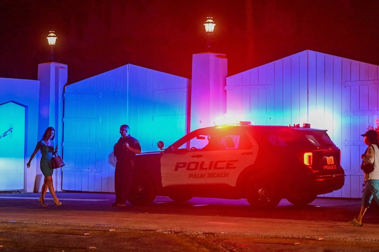 A police car is seen outside former president Donald Trump's residence in Mar-A-Lago, Palm Beach, Fla., on Aug. 8.