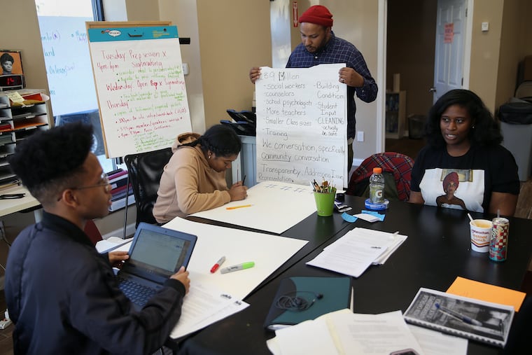 Youth activists opposed to a policy mandating the use of metal detectors in all Philadelphia public high schools shut down a school board meeting Thursday night. Shown here is Philadelphia Student Union executive director Julien Terrell (in hat), with students, as they prepared for the meeting earlier in the week.