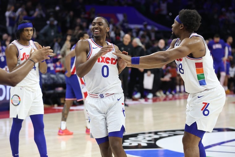 Sixers point guard Tyrese Maxey (0) celebrating with Guerschon Yabusele after a 117-104 victory over the Kings at the Wells Fargo Center on Jan. 29.