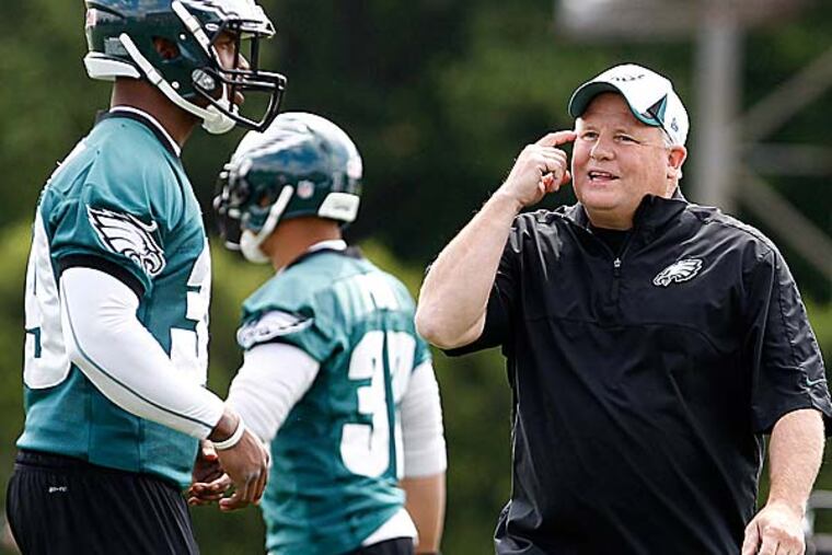 As the offensive players on the field regrouped from the play they'd just run, every head turned to the sideline. (David Maialetti/Staff Photographer)