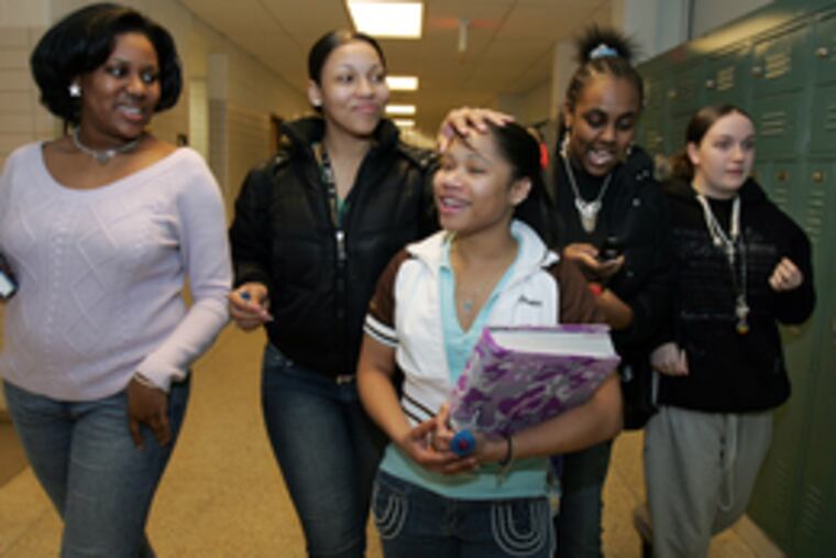 After a meeting of the Black Student Union, Coleman (left) walks with friends (from right) Kaitlyn Campbell, Shaniece Anderson, Devon Lee and Vanity Walls.