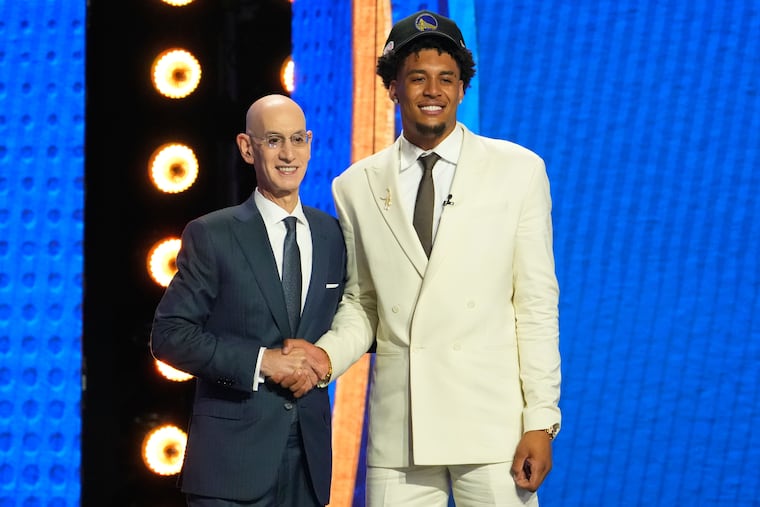 Yaxel Lendeborg (right) poses with NBA commissioner Adam Silver after being selected by the Golden State Warriors as the 11th pick in the first round of the NBA draft.